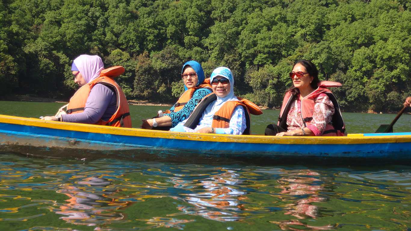Muslim Women from Malaysia are Boating on Lake
