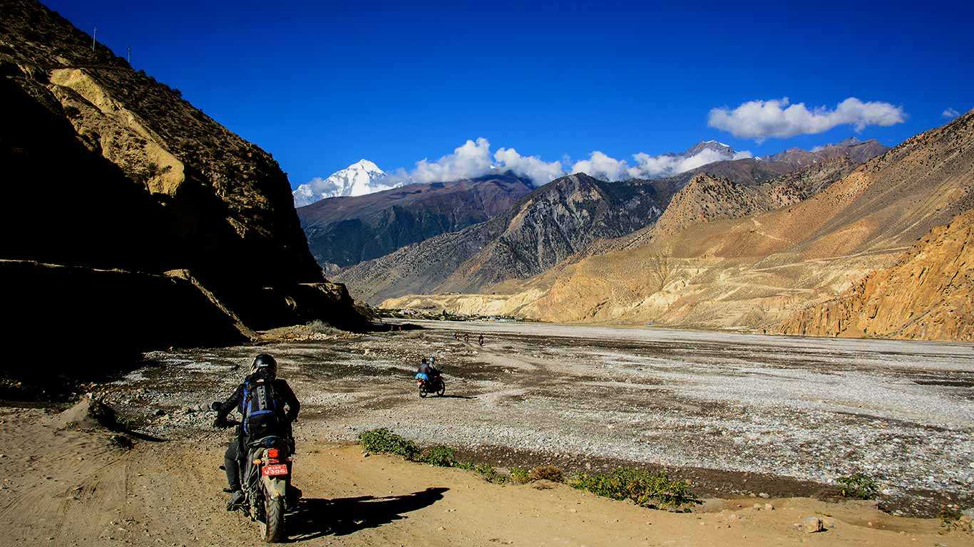Motorbike riding on kali gandaki river bank towards to upper mustang
